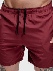 Burgundy performance shorts with drawstring and split hem detail