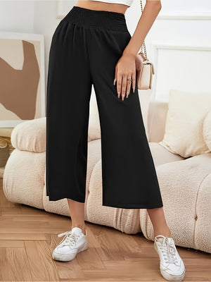 Black smocked waist culotte trousers with a wide leg and cropped length.