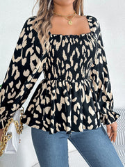 Black and cream leopard print smocked bodice square neck blouse with ruffled cuffs.