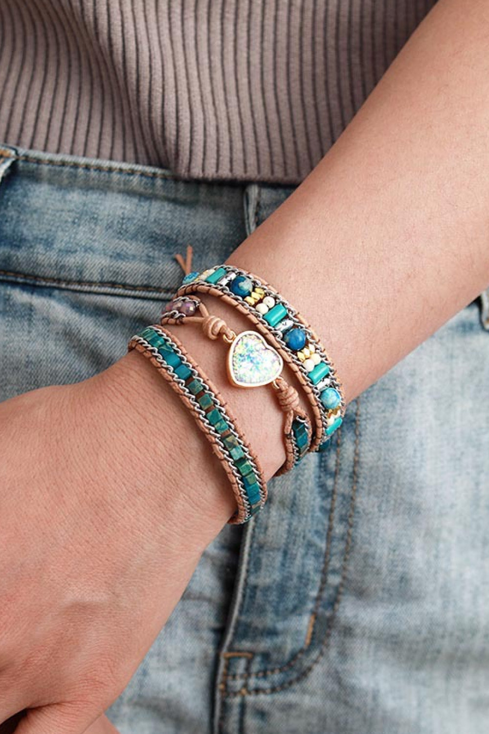 Bohemian wrap bracelet with teal beads and heart detail on leather cord.