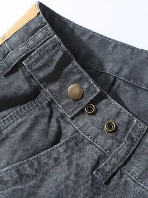 Grey sweatpants with snap button closure and ink-splash detail.