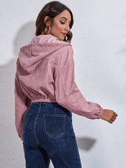 Cropped corduroy hooded jacket in blush pink with elastic hem and cuffs.