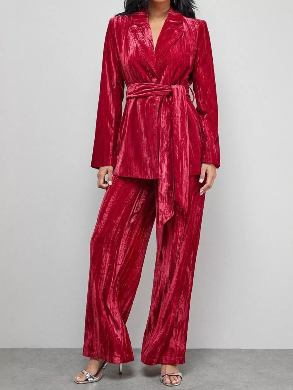 Burgundy velvet belted blazer and wide leg trousers ensemble