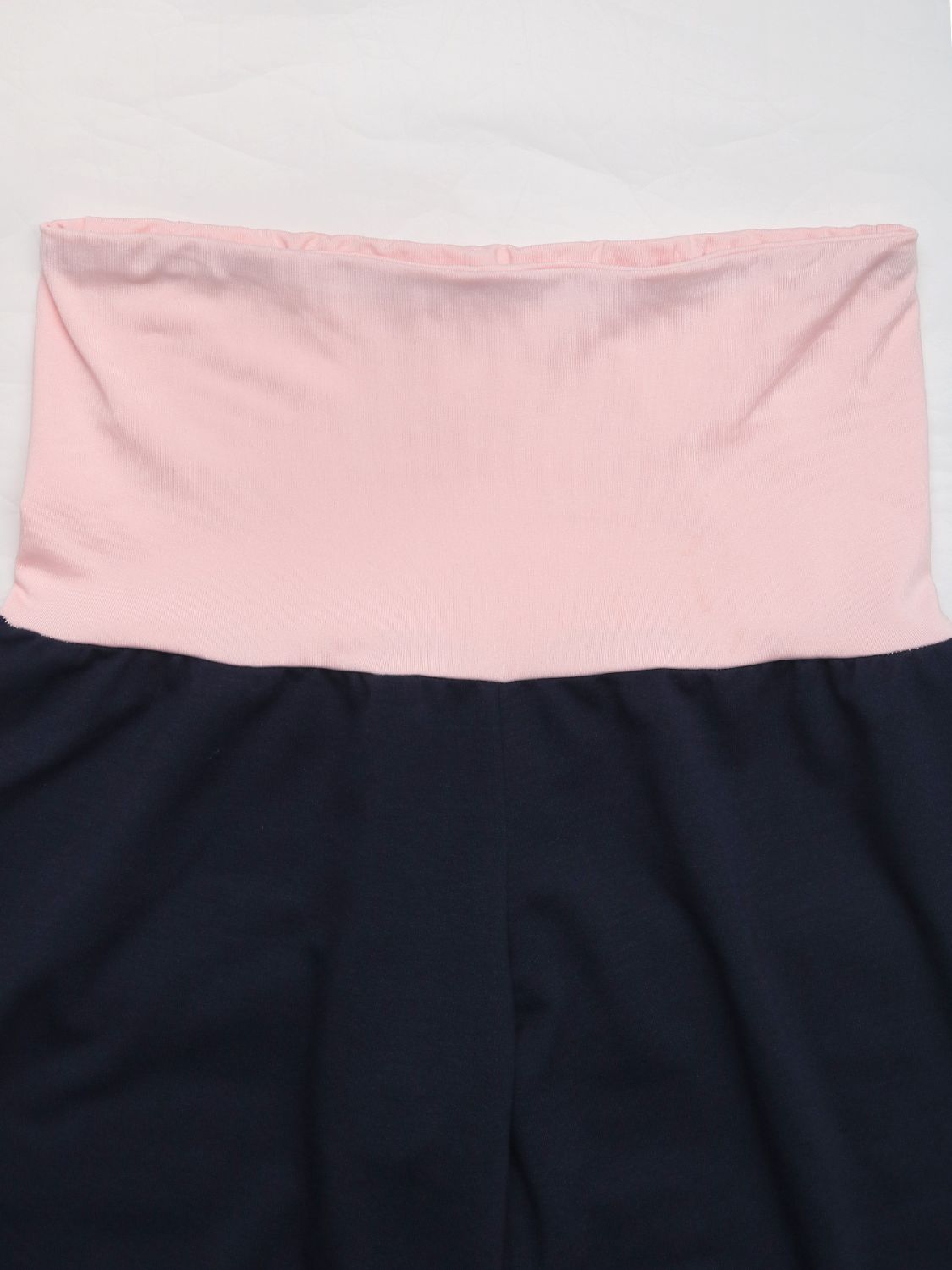 Navy palazzo pants with a pink contrast waistband