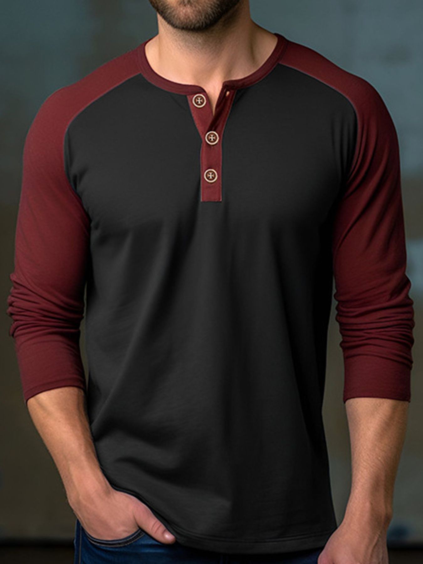 Men's black long sleeve henley t-shirt with wine red raglan sleeves and buttoned placket.