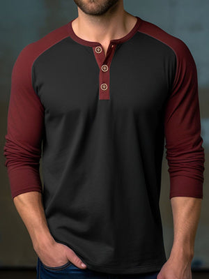 Men's black long sleeve henley t-shirt with wine red raglan sleeves and buttoned placket.