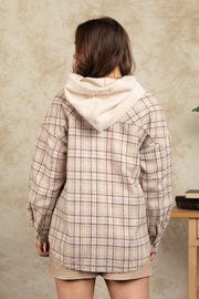 Cozy plaid shacket in Camel with sherpa hood, buttoned cuffs and relaxed fit.