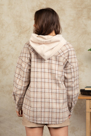 Cozy plaid shacket in Camel with sherpa hood, buttoned cuffs and relaxed fit.