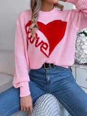 Blush pink knit sweater with red heart graphic and "love" text, crew neck, long sleeves.