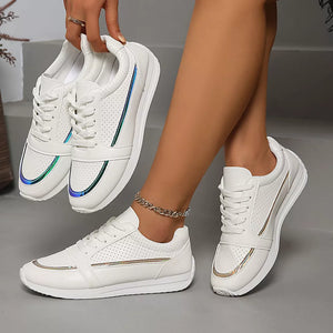 White lace-up sneakers with iridescent stripe detail and perforated accents.
