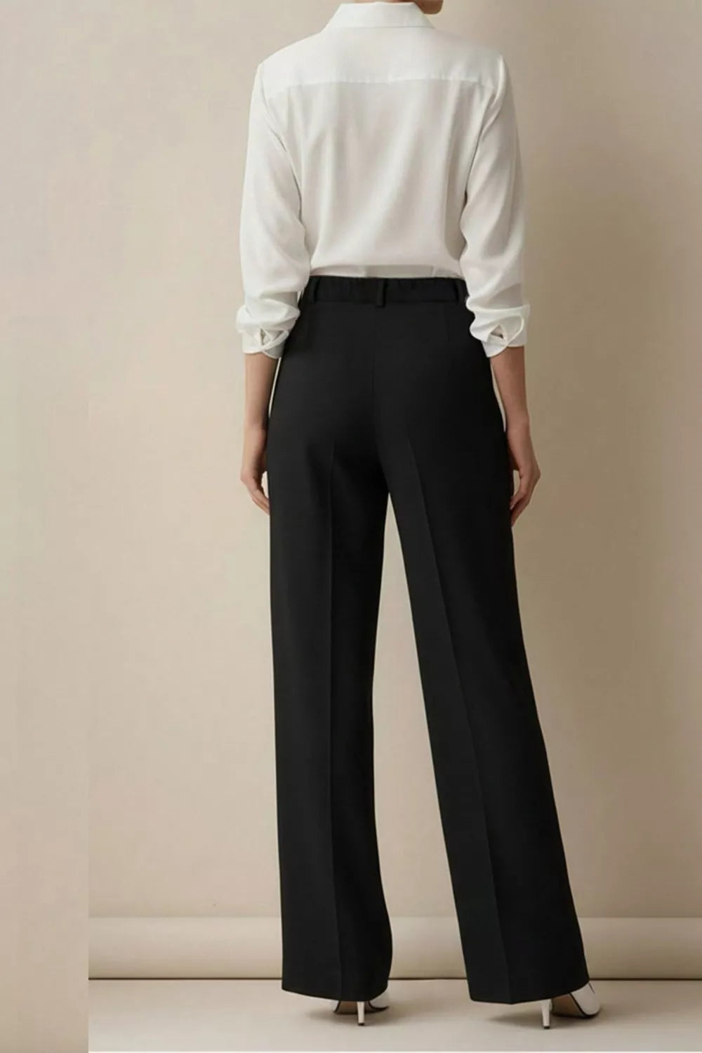 Black high-waisted wide-leg trousers with a belt and creased front.