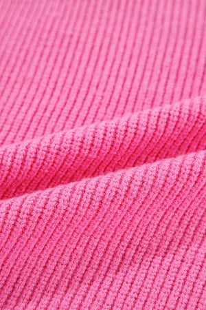 Fuchsia pink ribbed knit tank top showing texture and drape.