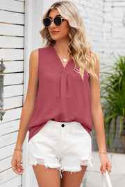 Burgundy textured sleeveless v-neck blouse with front pleats