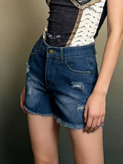 Dark blue distressed denim shorts with frayed hem and high waist.
