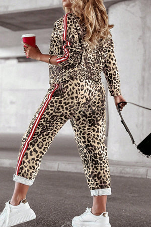 Leopard print joggers with red and white sporty side stripes.