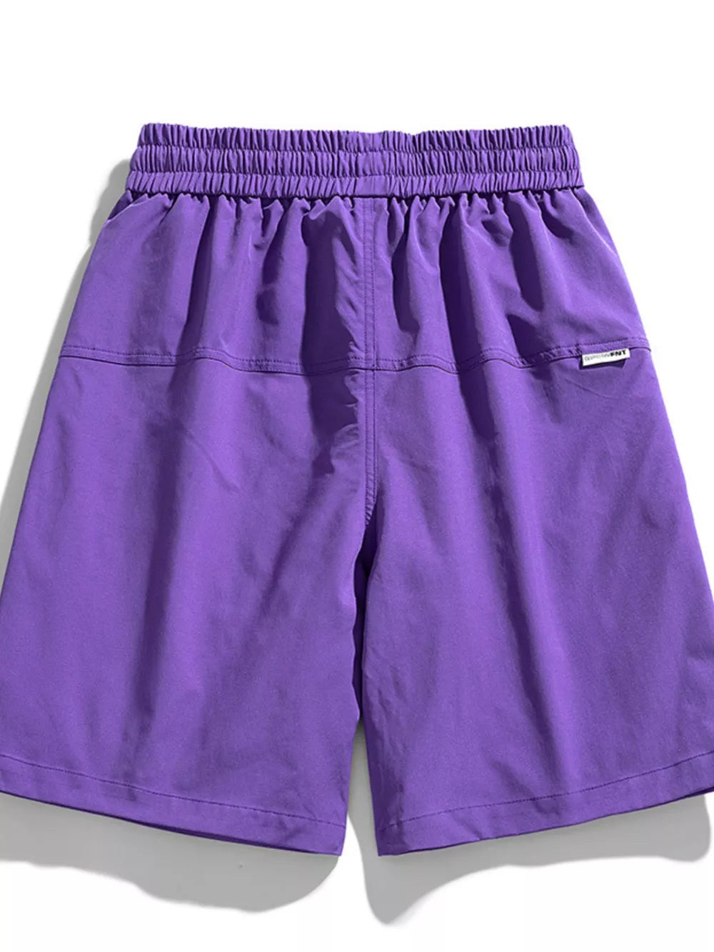 Purple relaxed fit cargo shorts with elastic waistband and back pocket detail.