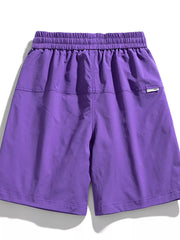 Purple relaxed fit cargo shorts with elastic waistband and back pocket detail.
