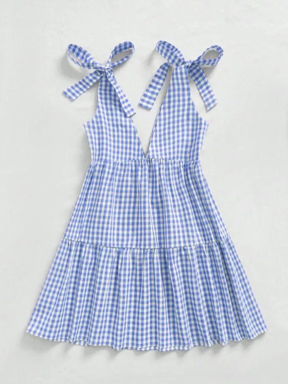 Blue gingham maternity mini dress with tie shoulders and ruffle hem