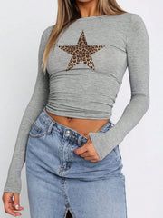Gray ruched crop top with leopard star print, long sleeves, and crew neck.