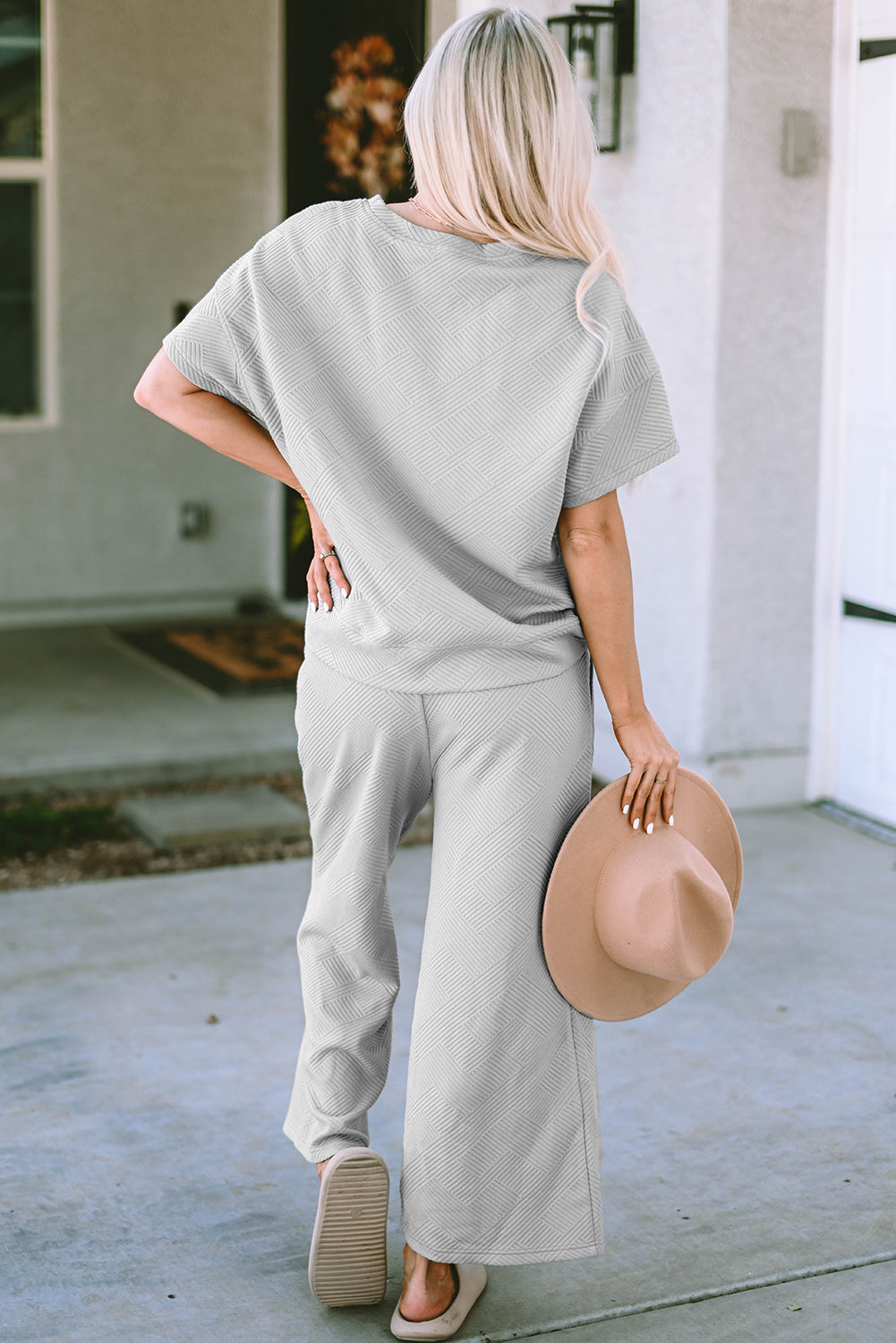 Light gray textured knit tee and wide leg pants set with short sleeves and a relaxed fit.