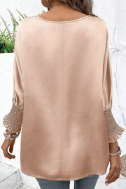 Satin batwing blouse in beige with shirred cuffs and crew neck.