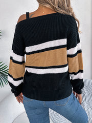 Asymmetric stripe knit sweater with one strap detail in black, camel, and white.