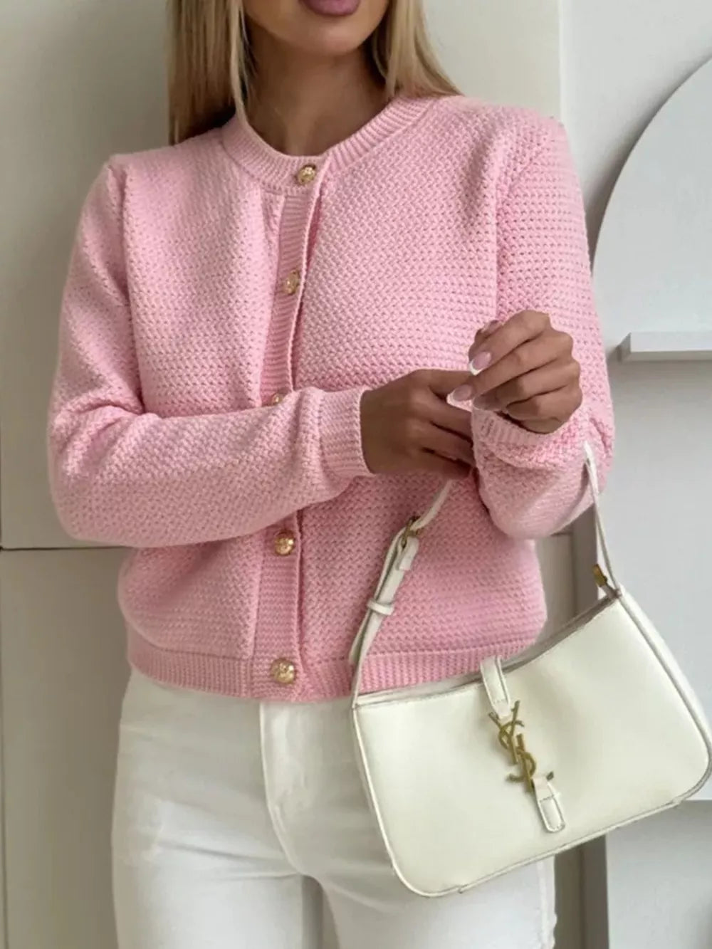 Textured knit cardigan in blush pink with gold button detail and crew neck.