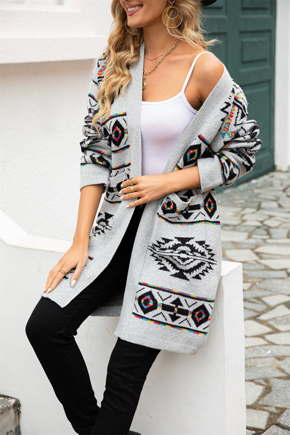 Light gray knit cardigan with Southwestern geometric pattern and open front.