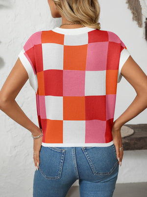 Checkerboard knit cap sleeve top in pink, orange, red, and white.
