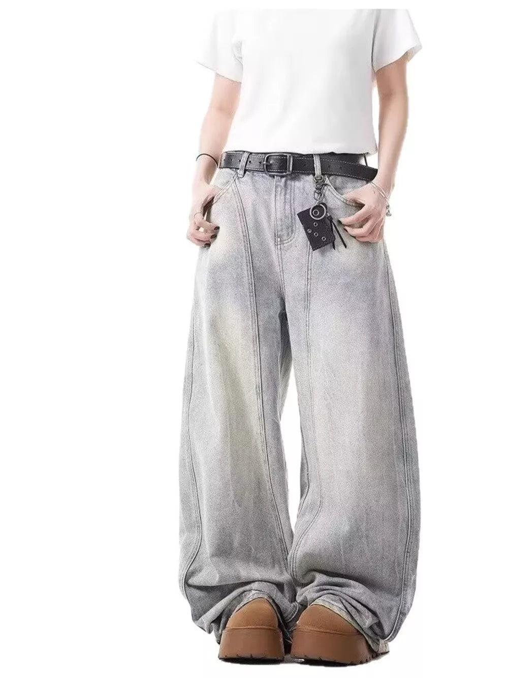 Light wash denim baggy jeans with a belted waist and keychain detail.