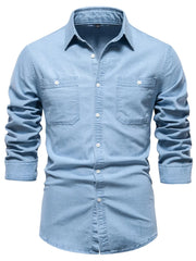 Light blue faded denim utility shirt with two chest pockets and button-down closure.