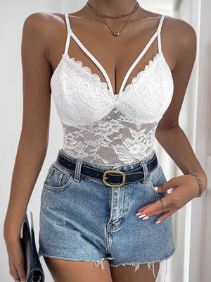 White floral lace bodysuit with crossover straps and scalloped trim.