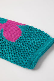 Openwork floral intarsia sweater in teal with pink bloom detail, acrylic knit.