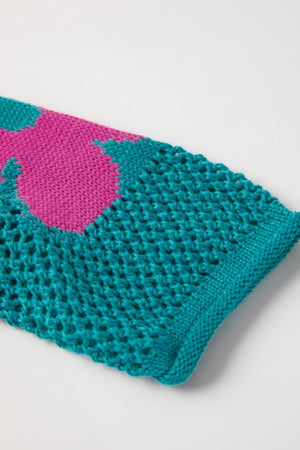 Openwork floral intarsia sweater in teal with pink bloom detail, acrylic knit.