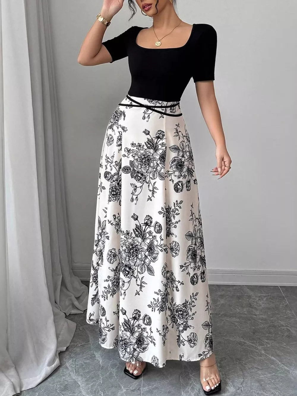 Chic floral maxi dress with square neckline and black bodice, black and white floral print skirt.