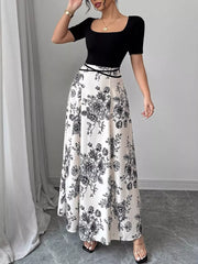 Chic floral maxi dress with square neckline and black bodice, black and white floral print skirt.