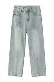 Light wash denim jeans with vertical seam detail and straight leg cut.