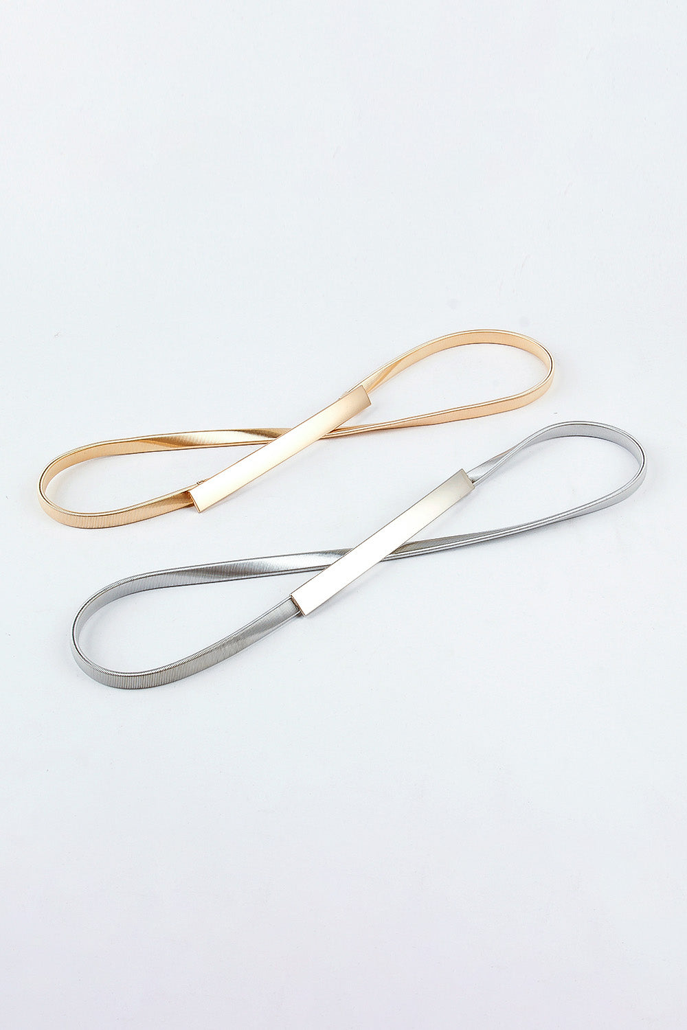 Slimline gold and silver metal waist belts with rectangular buckle detail
