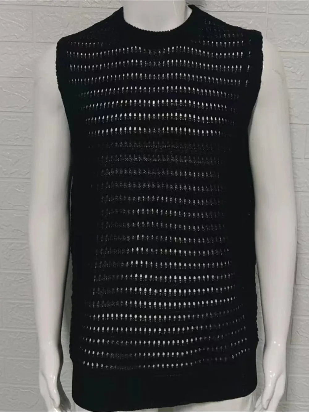 Black openwork knit tank top with a breathable acrylic blend, featuring a casual, basic style.