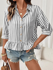 Button-down shirt with ruffle hem in gray and white stripes, 3/4 sleeves, and a collared neckline.