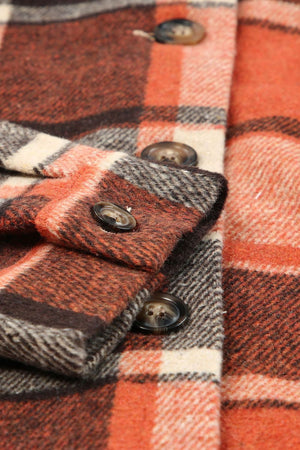 Plaid hooded shacket in orange with button details and a relaxed fit.
