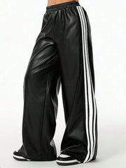 Black faux leather wide leg track pants with white side stripes and elastic waistband