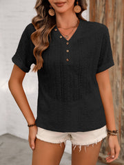 Black eyelet henley blouse with short sleeves and button detail