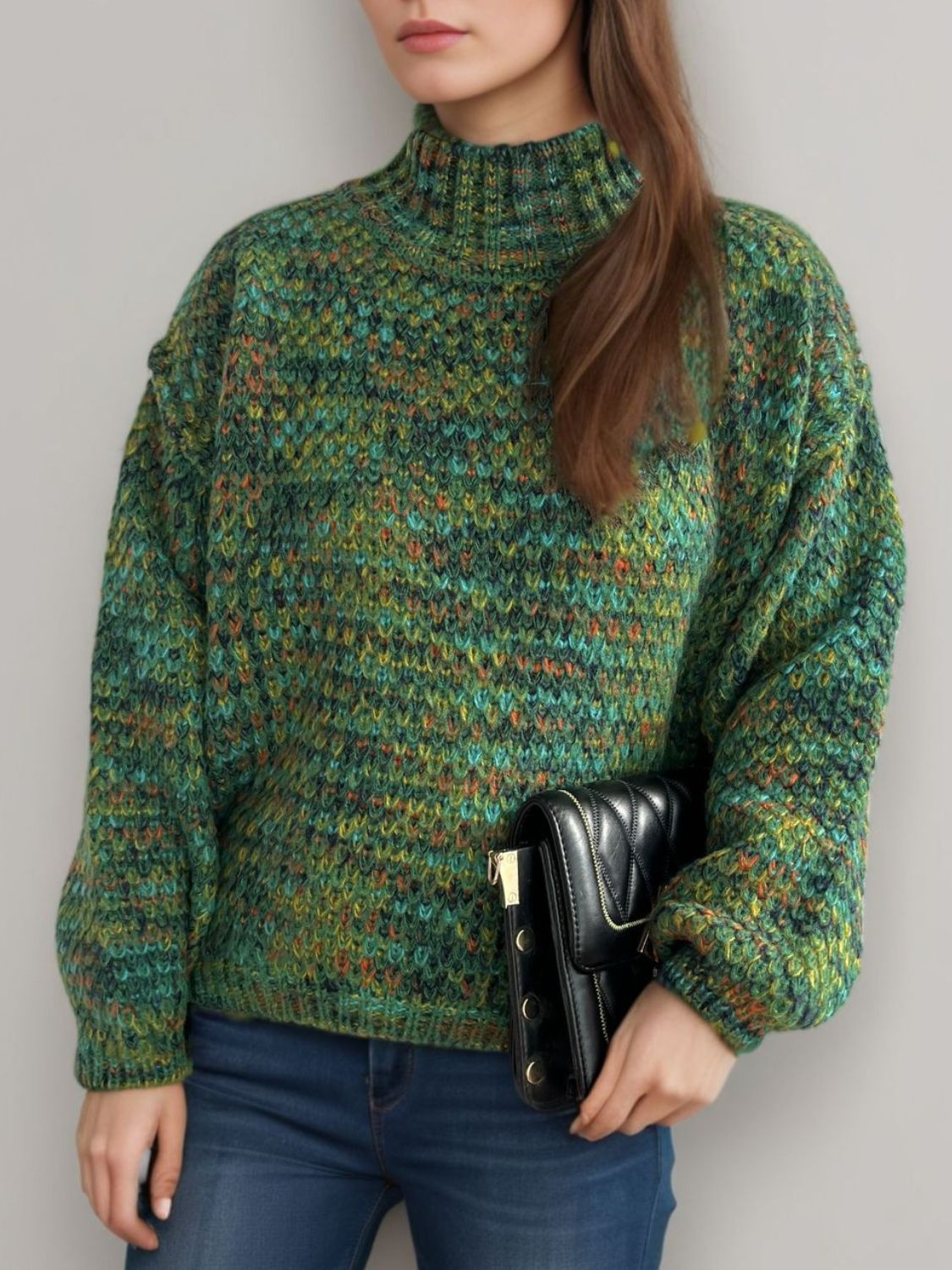 Textured mélange mock neck pullover sweater in dark green with a chunky knit and relaxed fit.