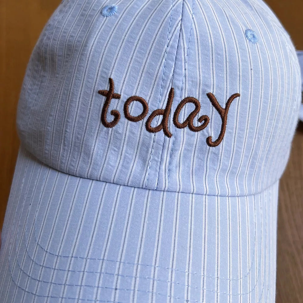 Blue pastel striped cotton baseball cap with embroidered "today" text.