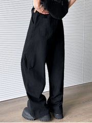 Men's black pocketed wide leg sweatpants with elastic waist and belt loops.