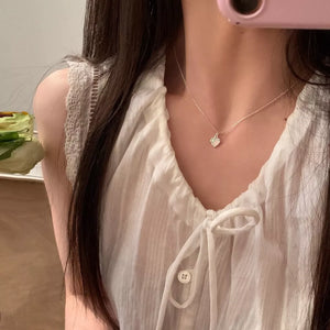 Charming heart pendant necklace in silver with a dainty chain.