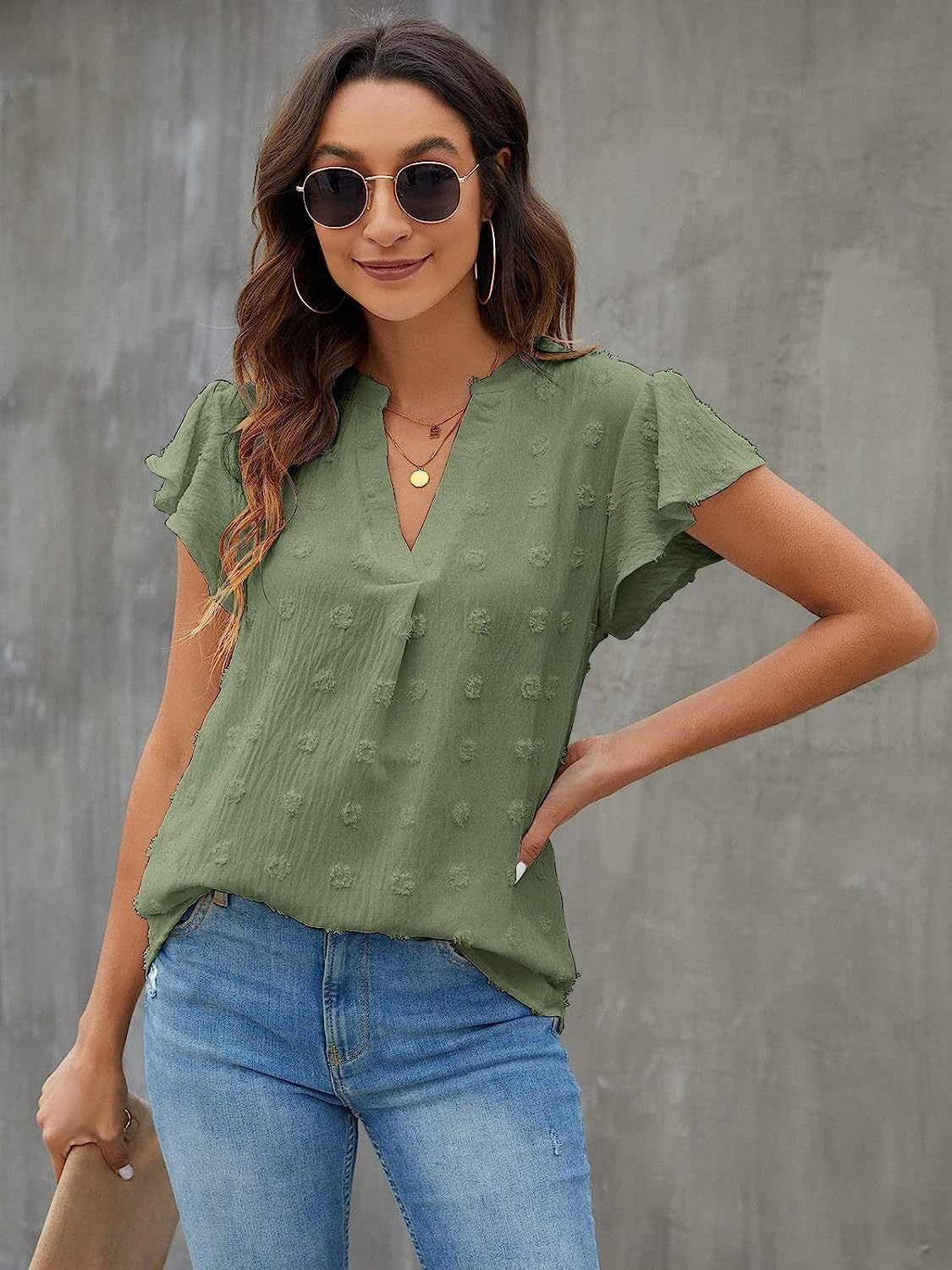 Flutter sleeve Swiss dot blouse in Matcha Green with a V-neckline.