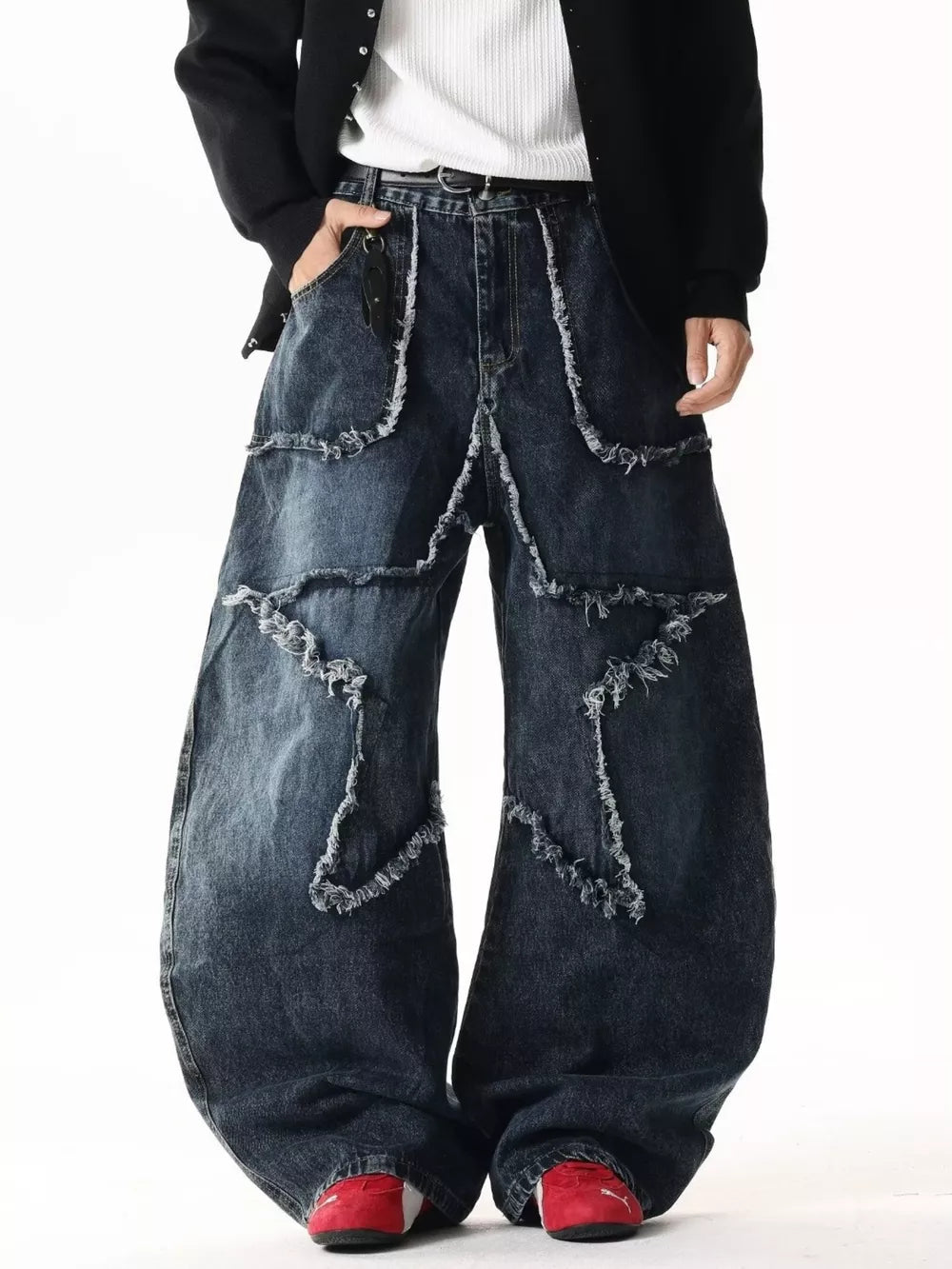 Star Patchwork Distressed Wide Leg Jeans in dark wash denim with frayed details.