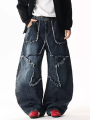 Star Patchwork Distressed Wide Leg Jeans in dark wash denim with frayed details.